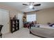 Cozy bedroom provides a ceiling fan, a closet, and a neutral wall color at 9469 Coral Shine Ct, Las Vegas, NV 89123