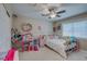 Charming bedroom with playful décor, a ceiling fan, and closet at 9469 Coral Shine Ct, Las Vegas, NV 89123
