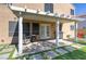 The covered patio has pavers, grass, and an outdoor seating area that is perfect for relaxing at 9469 Coral Shine Ct, Las Vegas, NV 89123