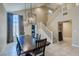 Dining area with large table and chairs, pendant lighting, and view of the staircase at 9469 Coral Shine Ct, Las Vegas, NV 89123
