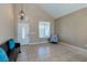 Inviting entryway with tile flooring, a decorative light fixture, and a comfortable sitting area at 9469 Coral Shine Ct, Las Vegas, NV 89123