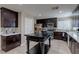 Modern kitchen with stainless steel appliances, granite countertops, and ample cabinet space at 9469 Coral Shine Ct, Las Vegas, NV 89123