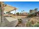 Backyard showing the patio, retaining wall, and desert landscaping at 10135 Diving Duck Ave, Las Vegas, NV 89117