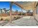 Backyard featuring a patio, retaining wall, desert landscaping, and privacy at 10135 Diving Duck Ave, Las Vegas, NV 89117