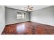 Bedroom with hardwood floors and a window at 10135 Diving Duck Ave, Las Vegas, NV 89117