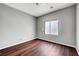 Bedroom featuring hardwood floors, neutral walls and a window providing natural light at 10135 Diving Duck Ave, Las Vegas, NV 89117