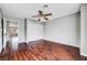 Bedroom featuring hardwood floors and a closet at 10135 Diving Duck Ave, Las Vegas, NV 89117