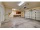 Spacious garage with storage shelves, work bench, and two car capacity at 10135 Diving Duck Ave, Las Vegas, NV 89117
