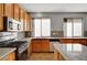 Bright kitchen offering stainless steel appliances and granite countertops at 10135 Diving Duck Ave, Las Vegas, NV 89117