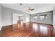 Spacious main bedroom features beautiful wood floors and a ceiling fan at 10135 Diving Duck Ave, Las Vegas, NV 89117