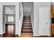 Stairway with hardwood steps and white railing connecting different levels of the home at 10135 Diving Duck Ave, Las Vegas, NV 89117