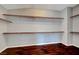 Walk-in closet with shelving and hardwood floors at 10135 Diving Duck Ave, Las Vegas, NV 89117
