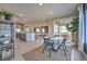 Inviting dining area with contemporary furnishings, seamless flow to other living spaces, and ample natural light at 1048 Forrest Falcon Dr, Henderson, NV 89011