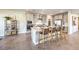 Contemporary kitchen with stainless steel appliances, a spacious island with seating, and ample cabinet space at 1048 Forrest Falcon Dr, Henderson, NV 89011