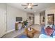 Open-concept living space with kitchenette, comfortable seating, and convenient access to other rooms at 1048 Forrest Falcon Dr, Henderson, NV 89011