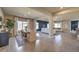 Open-concept living and dining area with lots of natural light and elegant decor at 1048 Forrest Falcon Dr, Henderson, NV 89011