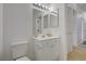 Bright bathroom features a single vanity with decorative accents and a large framed mirror at 10525 Pine Glen Ave # 206, Las Vegas, NV 89144