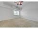 Bright bedroom features neutral carpet, a ceiling fan, and a window letting in natural light at 10525 Pine Glen Ave # 206, Las Vegas, NV 89144