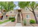 Condo exterior with stairs to the front door, attractive landscaping at 10525 Pine Glen Ave # 206, Las Vegas, NV 89144
