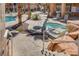 Community hot tub with multiple chairs and tables at 10525 Pine Glen Ave # 206, Las Vegas, NV 89144