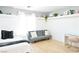 Cozy bedroom with a futon, desk, light wood flooring, and built-in shelves at 10591 Haywood Dr, Las Vegas, NV 89135