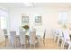 Dining room with natural light, modern chandelier, and a stylish dining table with seating for eight at 10591 Haywood Dr, Las Vegas, NV 89135