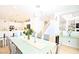 Open dining area with a modern table set, seamlessly connecting to the kitchen and living spaces at 10591 Haywood Dr, Las Vegas, NV 89135