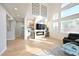 Inviting living room with large windows, fireplace, and ample natural light at 10591 Haywood Dr, Las Vegas, NV 89135