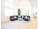 Spacious living room with high ceilings, ample windows, and modern decor at 10591 Haywood Dr, Las Vegas, NV 89135