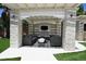 Outdoor living space with a covered patio, comfortable seating, and a built-in TV at 10591 Haywood Dr, Las Vegas, NV 89135