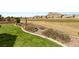 Backyard featuring artificial turf and desert landscaping overlooking the golf course at 10712 Back Plains Dr, Las Vegas, NV 89134