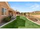 Backyard area with a covered patio overlooking the community golf course at 10712 Back Plains Dr, Las Vegas, NV 89134
