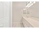 Bathroom with a large vanity, bright lighting, and a mirror that spans the length of the counter at 10712 Back Plains Dr, Las Vegas, NV 89134