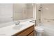 Bright bathroom featuring a vanity, toilet, bathtub, and a marble-look walk-in shower at 10712 Back Plains Dr, Las Vegas, NV 89134
