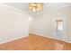 Bedroom featuring hardwood floors, a ceiling fan, and backyard access at 10712 Back Plains Dr, Las Vegas, NV 89134