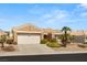 Beautiful single-story home featuring desert landscaping, a tile roof, and a two-car garage at 10712 Back Plains Dr, Las Vegas, NV 89134