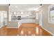 Open kitchen with white cabinets, stainless steel appliances, and granite countertops at 10712 Back Plains Dr, Las Vegas, NV 89134