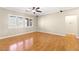 Spacious living room featuring hardwood floors and large windows at 10712 Back Plains Dr, Las Vegas, NV 89134