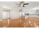 Bright living area featuring hardwood floors and access to the kitchen at 10712 Back Plains Dr, Las Vegas, NV 89134