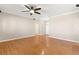 Large living room with hardwood floors, a ceiling fan, and an open floor plan at 10712 Back Plains Dr, Las Vegas, NV 89134