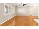 Open-concept living room featuring hardwood floors and large windows at 10712 Back Plains Dr, Las Vegas, NV 89134