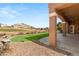 Covered patio with beautiful views of the green golf course and mountains at 10712 Back Plains Dr, Las Vegas, NV 89134