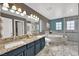 Elegant bathroom with double vanity, granite countertops, soaking tub, and glass enclosed shower at 10902 Fintry Hills St, Las Vegas, NV 89141