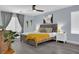 Inviting bedroom featuring a ceiling fan, natural light, and stylish decor at 10902 Fintry Hills St, Las Vegas, NV 89141