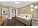 Bright bedroom featuring a daybed, stylish round mirror, and closet with built-in storage at 10902 Fintry Hills St, Las Vegas, NV 89141