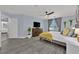 Serene bedroom with a ceiling fan, streaming device, and an en suite bathroom at 10902 Fintry Hills St, Las Vegas, NV 89141