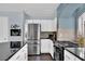 Spacious kitchen with stainless steel appliances, a large island, and stylish decor at 10902 Fintry Hills St, Las Vegas, NV 89141