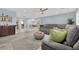Spacious living room showcasing a comfortable sectional sofa and direct access to a wet bar at 10902 Fintry Hills St, Las Vegas, NV 89141