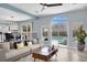 Cozy living room with a view of the pool through large windows, creating a relaxing atmosphere at 10902 Fintry Hills St, Las Vegas, NV 89141