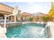 Expansive backyard featuring a large pool with waterfall, spa, fire pit, basketball court, and outdoor seating areas at 12430 Foxtail Run Ave, Las Vegas, NV 89138
